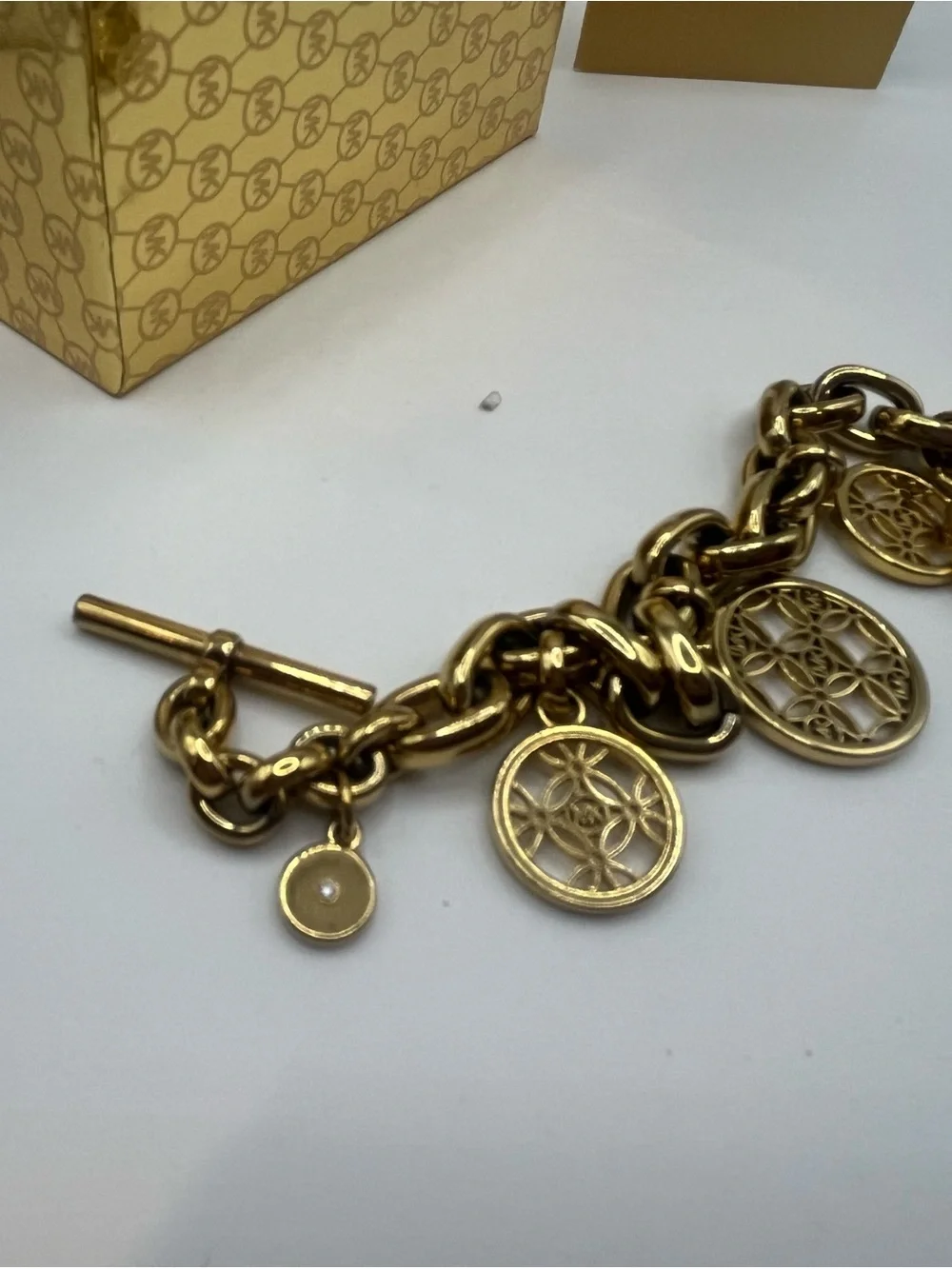 Michael Kors Gold Tone Charm Toggle Bracelet MK Logo Medallion NWT in Box